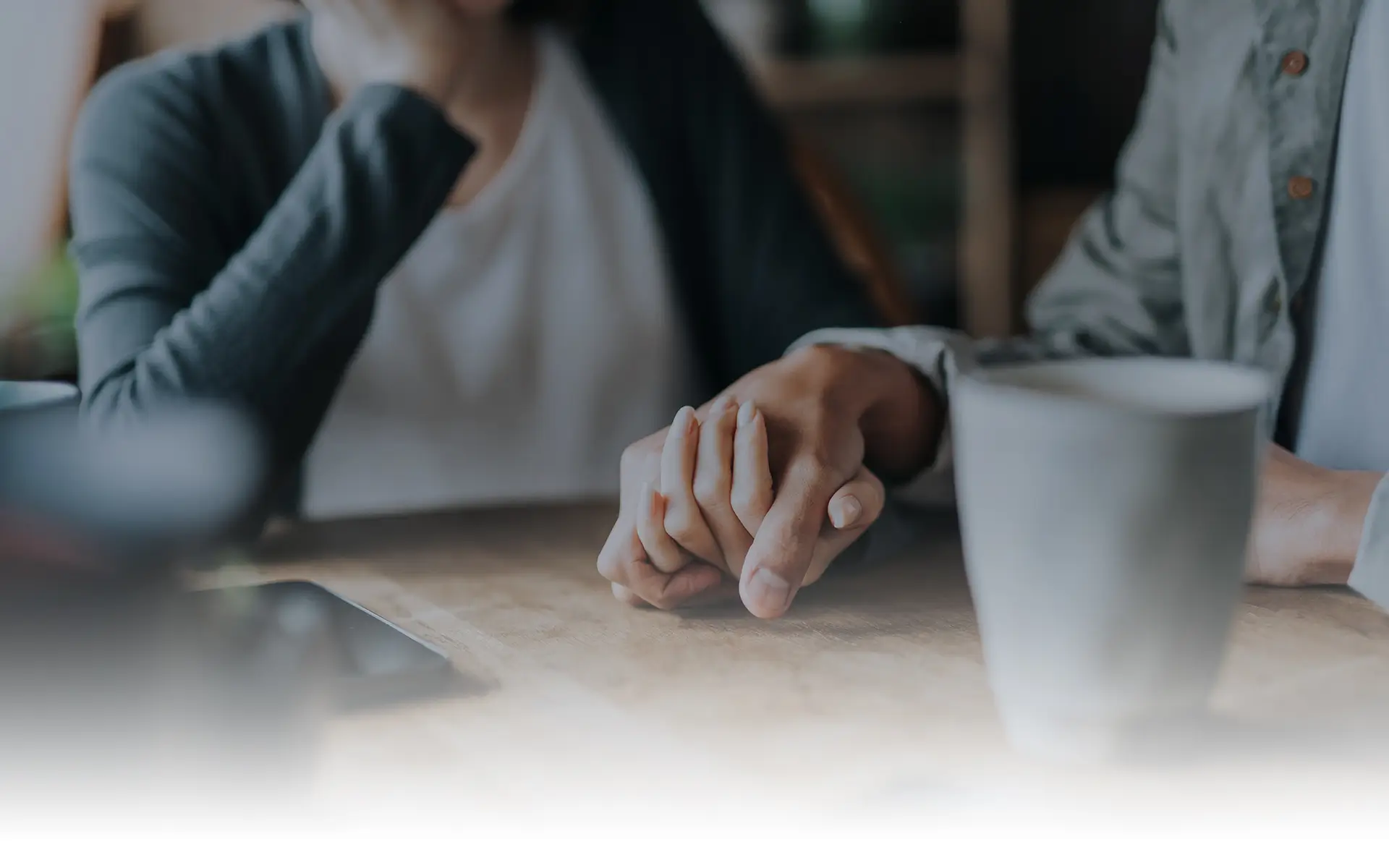 Man and wife holding hands as clients at Putnam Lieb Potvin Dailey in Olympia, Washington